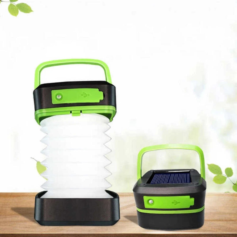 Green and black collapsible lantern shown expanded and folded