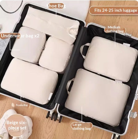 Beige six-piece packing set packed side by side in a suitcase
