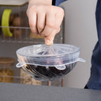 Silicone stretch lid covering a bowl of fruit