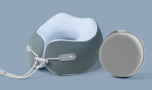 Dark green neck pillow beside its storage case
