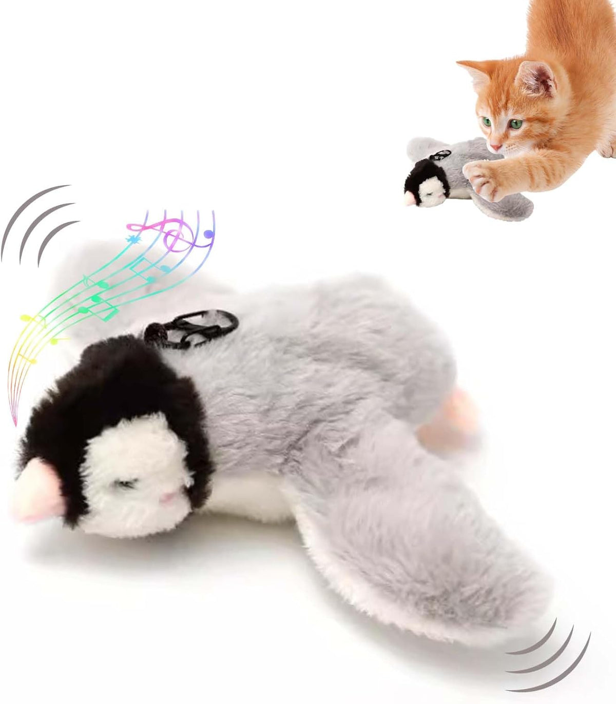 Grey penguin toy with a black-and-white head, flapping, with a kitten
