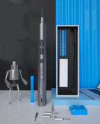 Precision screwdriver standing beside its box of bits on a desk