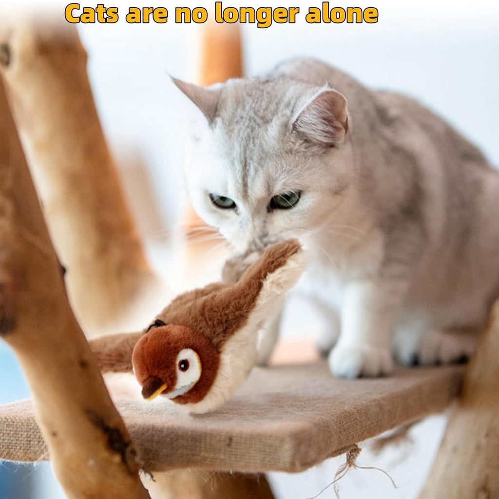 Cat holding a brown plush bird toy with a feather tail