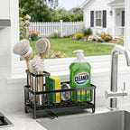 Sink caddy holding brushes, a sponge and dish soap by a kitchen window