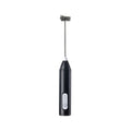 Black handheld milk frother with its metal whisk attached, on a white background.