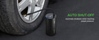 Tire inflator connected to a car tire valve; it stops automatically at the preset pressure.