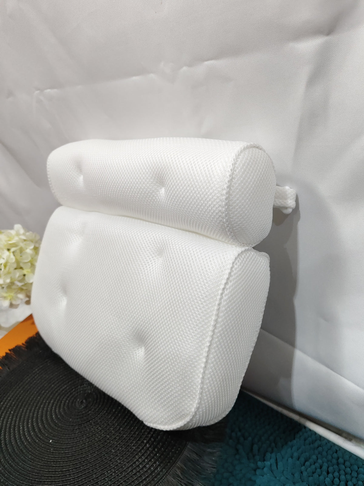 Bath pillow with its hook, side view