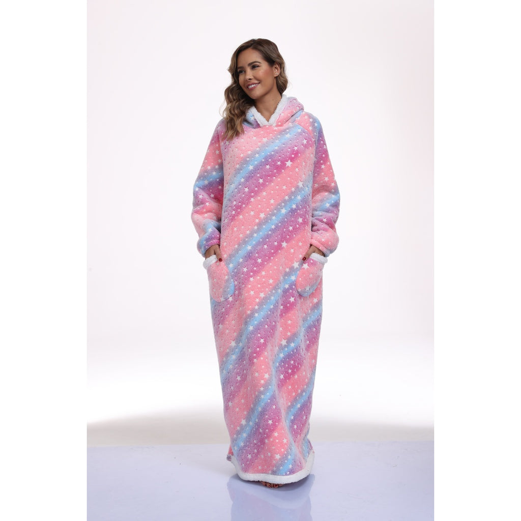 Model wearing a long pink and blue star-print hooded blanket with front pockets