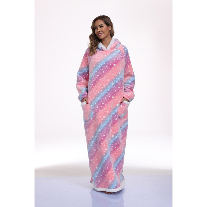 Model wearing a long pink and blue star-print hooded blanket with front pockets
