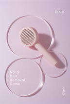 Pink pet grooming brush with metal bristles on a pink display background