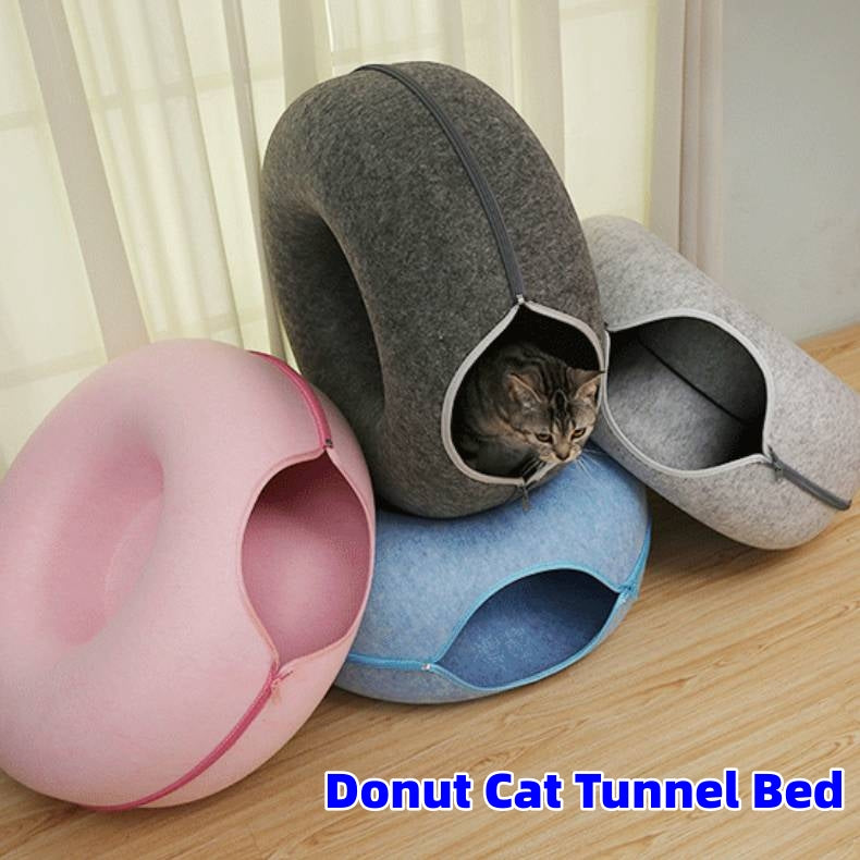 Four felt cat tunnel beds in pink, blue and gray, with a cat in one opening