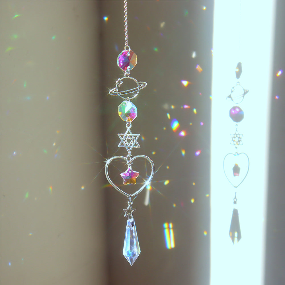 Hanging planet, star and heart decoration with faceted accents reflecting colored light